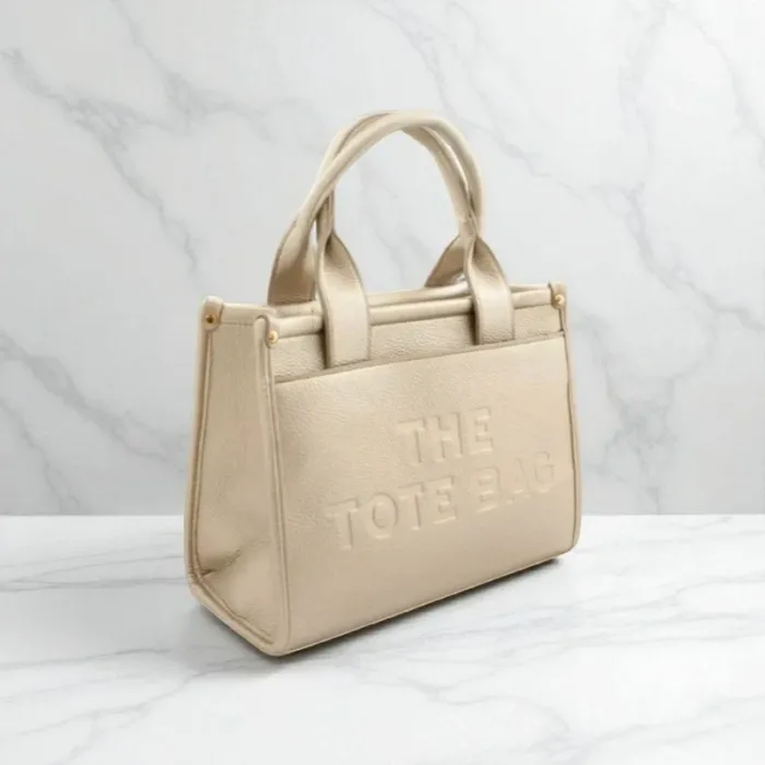Sac the tote bag doré taille moyenne neuf 30x22x10 cm