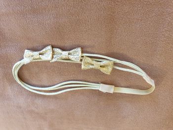 Bandeau fille bébé nœuds dorés