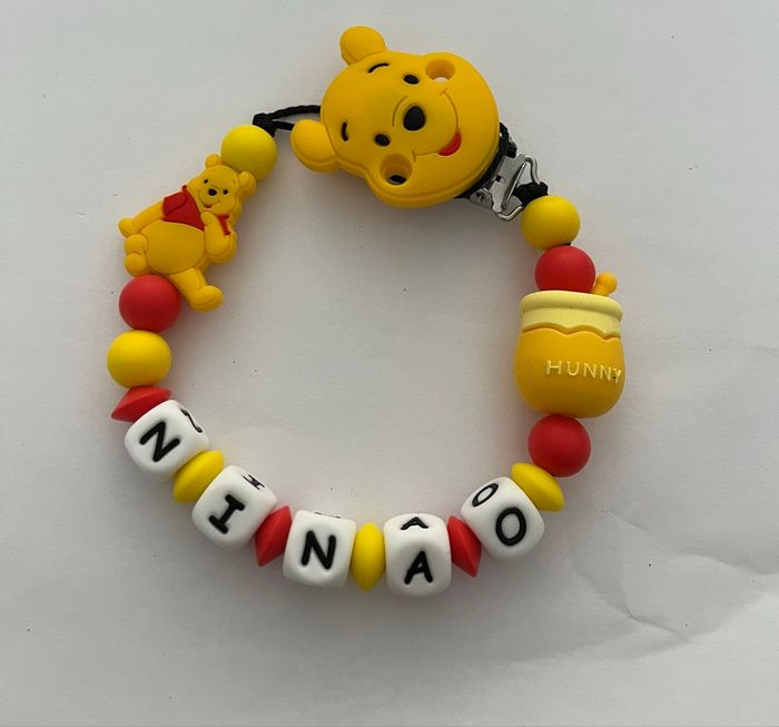 Attache tétine Winnie l’ourson