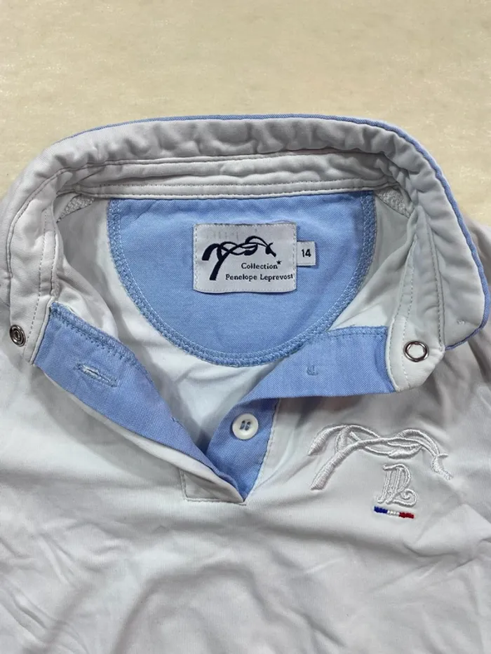 👕 Polo équitation Penelope Leprevost – Taille 14 ans – Blanc et bleu ciel – Très bon état - photo numéro 2