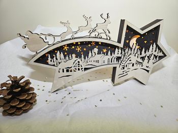 Étoile de Noël illuminée en bois