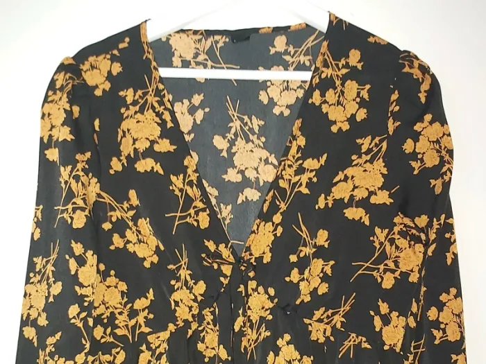 Neuf- top péplum noir/ocre