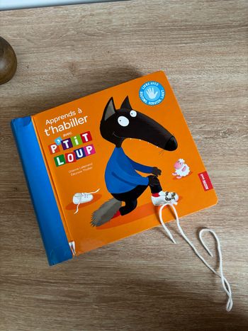 Livre apprends à t’habiller avec p’tit loup Auzou éveil