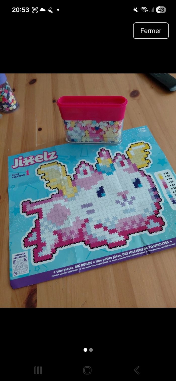 Puzzle jixelz petit modèle en très bon état dans sa boîte d origine modèle narval et chat licorne