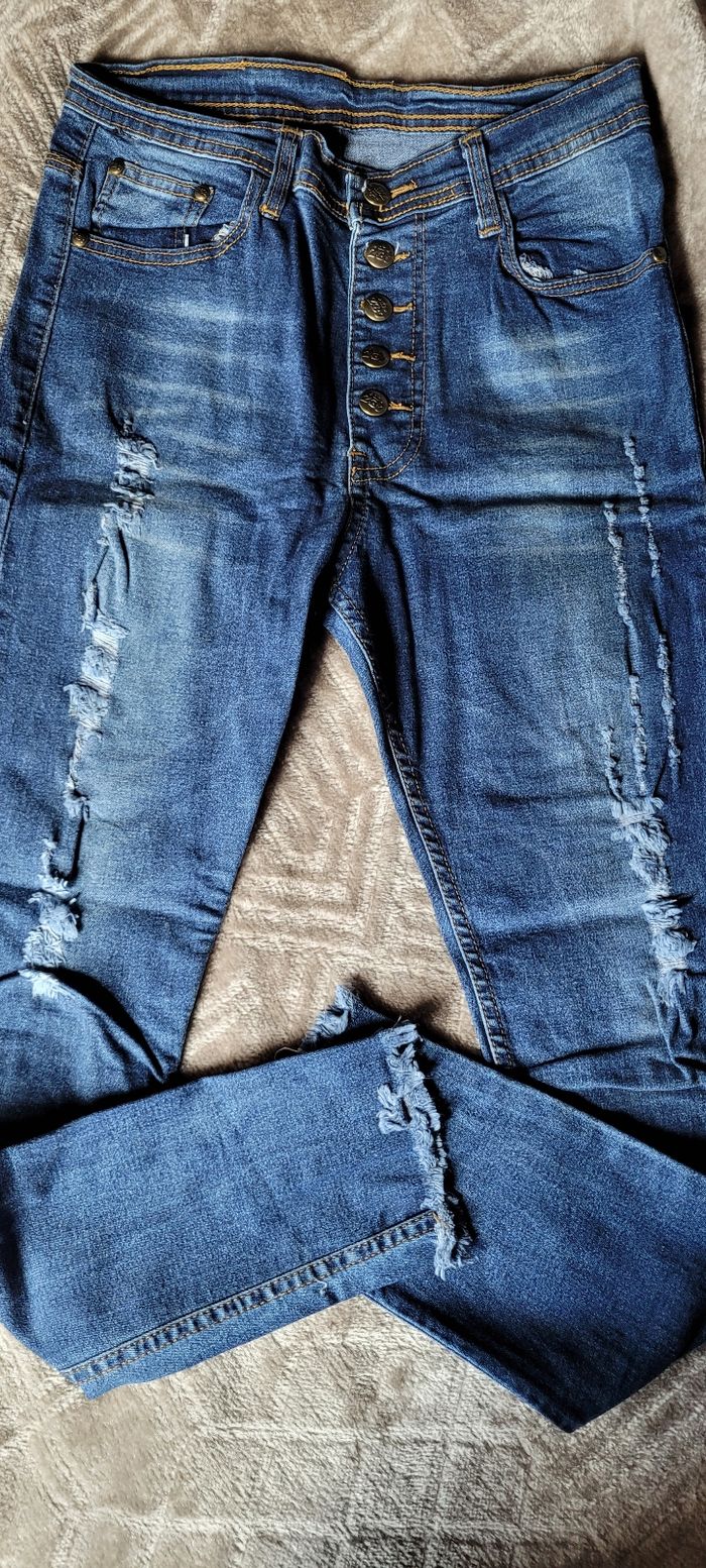 Jean's troué - photo numéro 1
