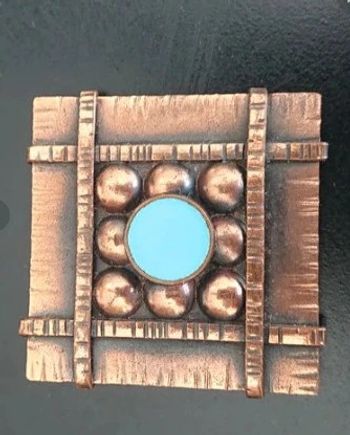 Broche art déco signée Jean augis en bronze