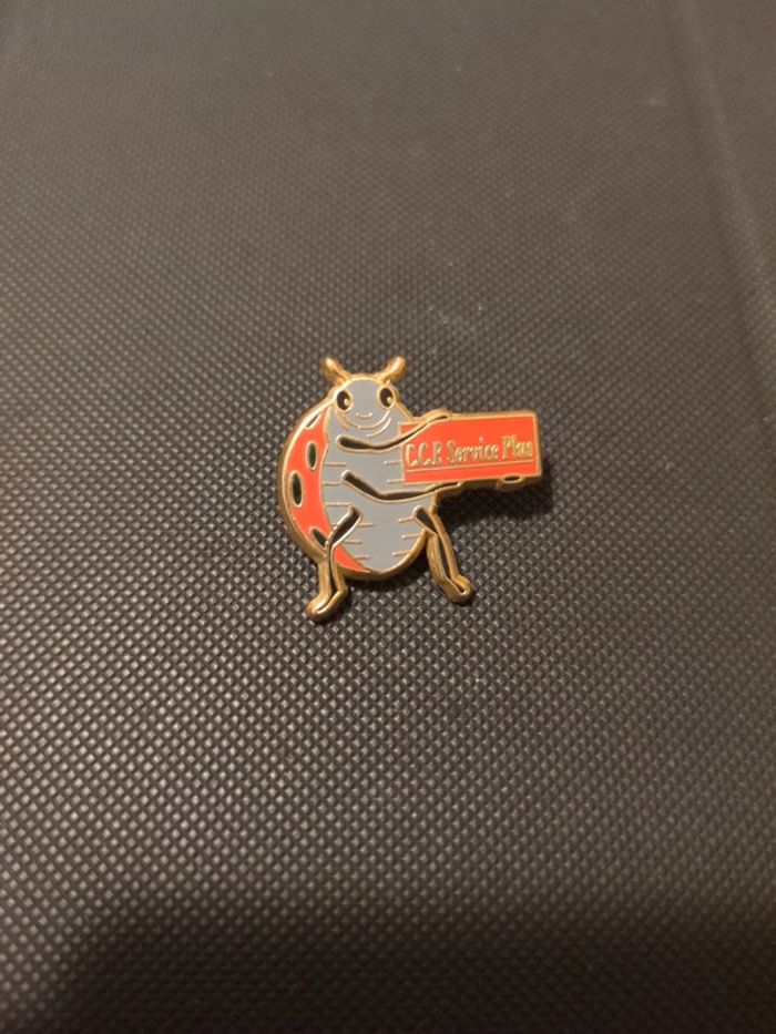 Pin's coccinelle CCP signé Starpin's