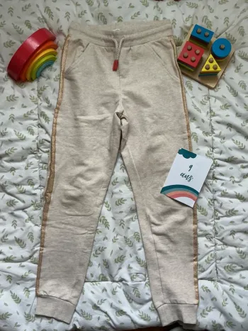 pantalon beige bande a paillettes lien de serrage grain de blé 9 ans