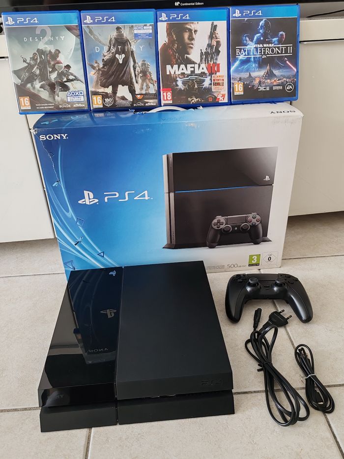 PS4 500Go – Très bon état + 4 jeux + manette Battletron quasi neuve