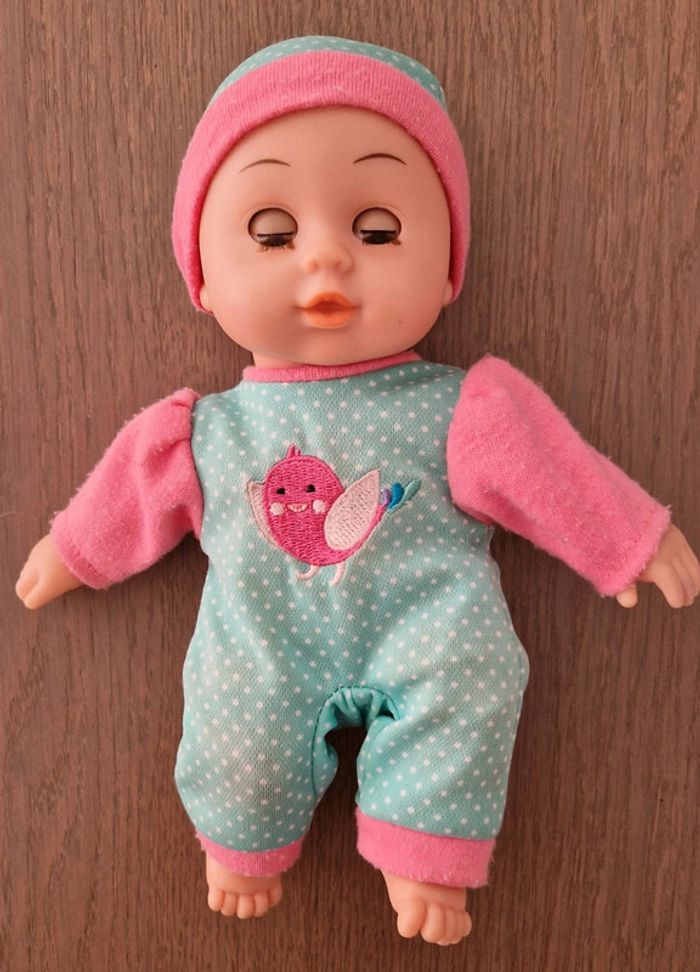 Poupon yeux dormants environ 23 cm en bon état