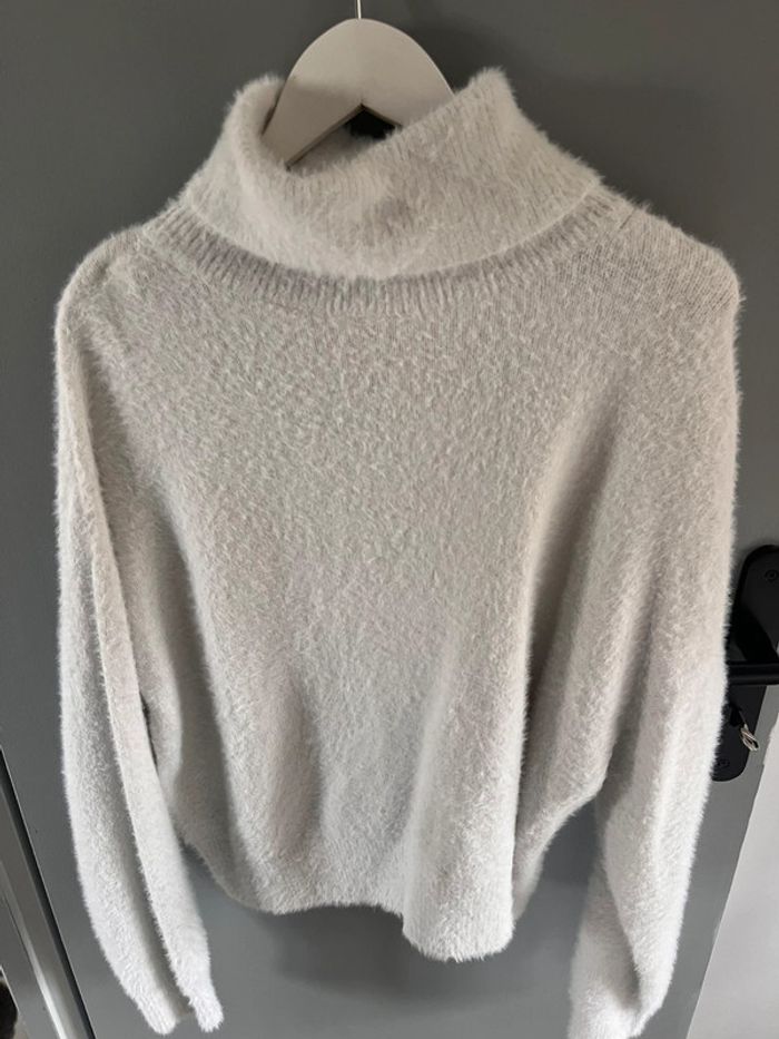 Pull col roulé
