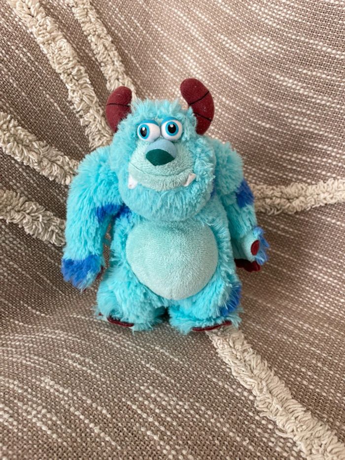 Peluche doudou 18cm Disney monstre et cie Sully bleu et violet très bon état
