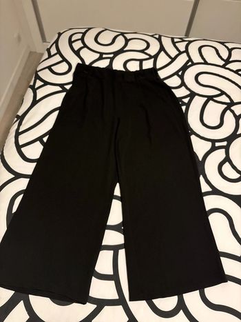 Pantalon noir jambes évasées