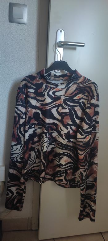 Joli haut seyant Taille L