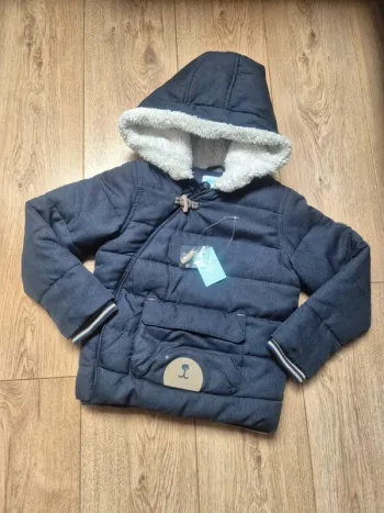 Blouson chaud "obaibi" bleue motif ourson 5 ans en excellent état