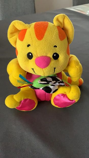 Peluche tigre vibreur en tirant sur le papillon Fisher Price