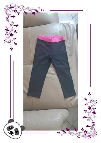 Legging de sport 3/4 h&m noir/rose fuchsia 6/8 ans en très bon état
