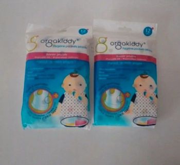 2 paquets de bavoirs jetable neuf .  orgakiddy.