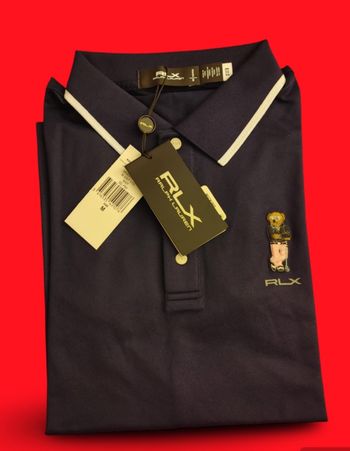 Polo Ralph Lauren. 
Femme. 
Sport RLX. Taille M. 
Tailored Fit. 
54 % Polyester. 
45 % Cotton. 