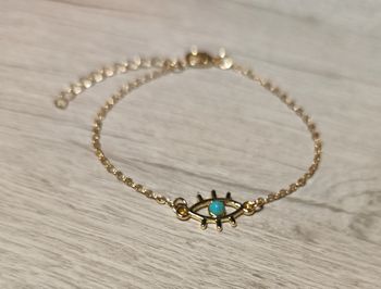Bracelet doré avec breloque oeil bleu turquoise ajustable