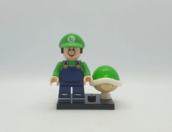 🍄 Figurine Super Mario - Bébé Luigi avec une Carapace Verte - (Style Lego) 🍄