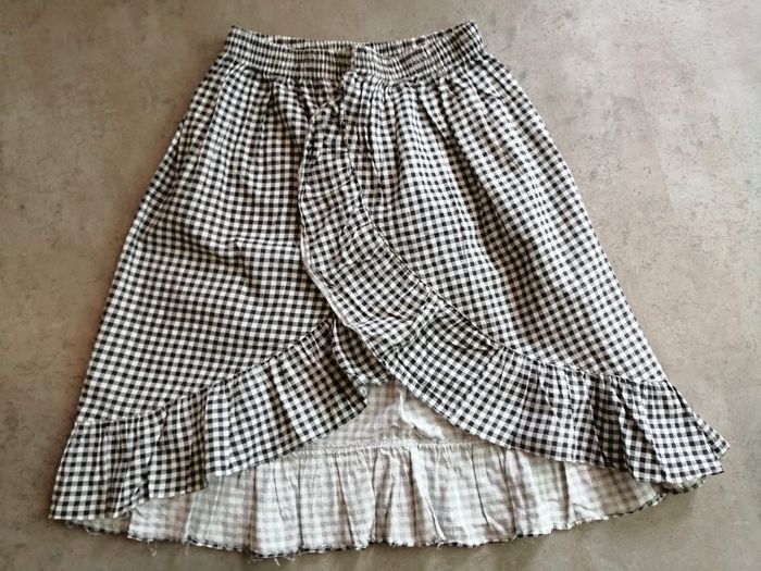 jupe à carreaux noire et blanche 10 ans Essam