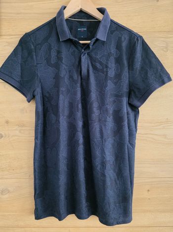 Polo marine
Devred 
Coupe droite
Matière très souple et agréable à porter
TBE