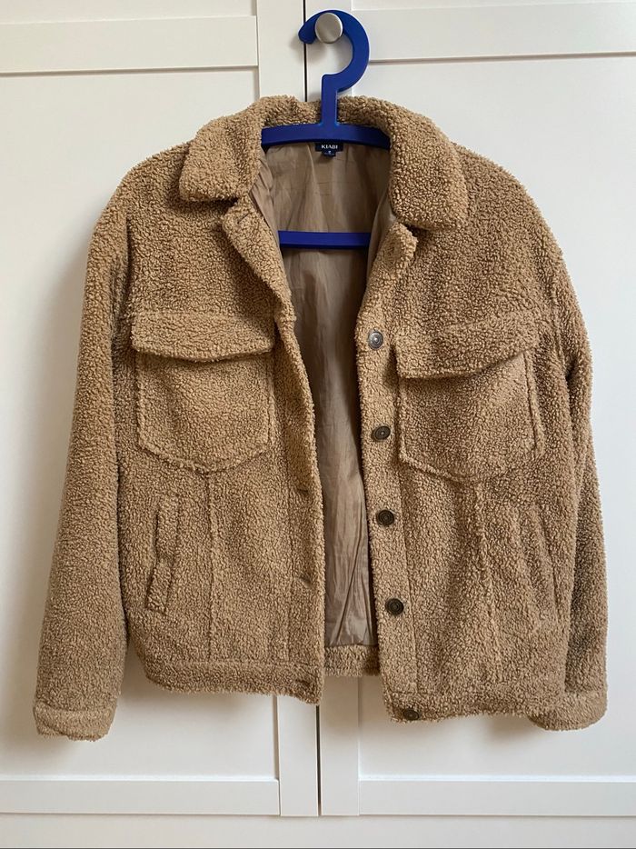 Manteau fausse fourrure beige
