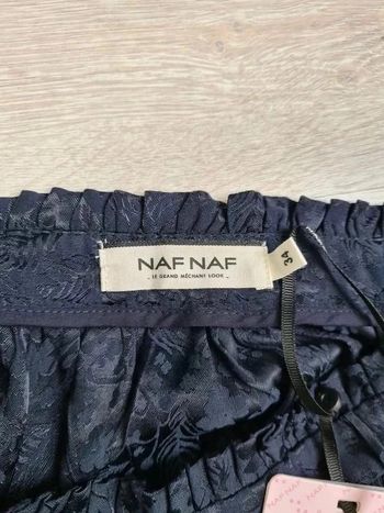 Jupe courte brillante nafnaf taille 34 bleu marine neuve avec étiquette motif fleurs