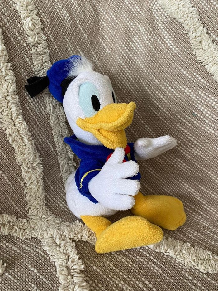 Peluche doudou 25cm Disney Donald canard blanc et bleu très bon état