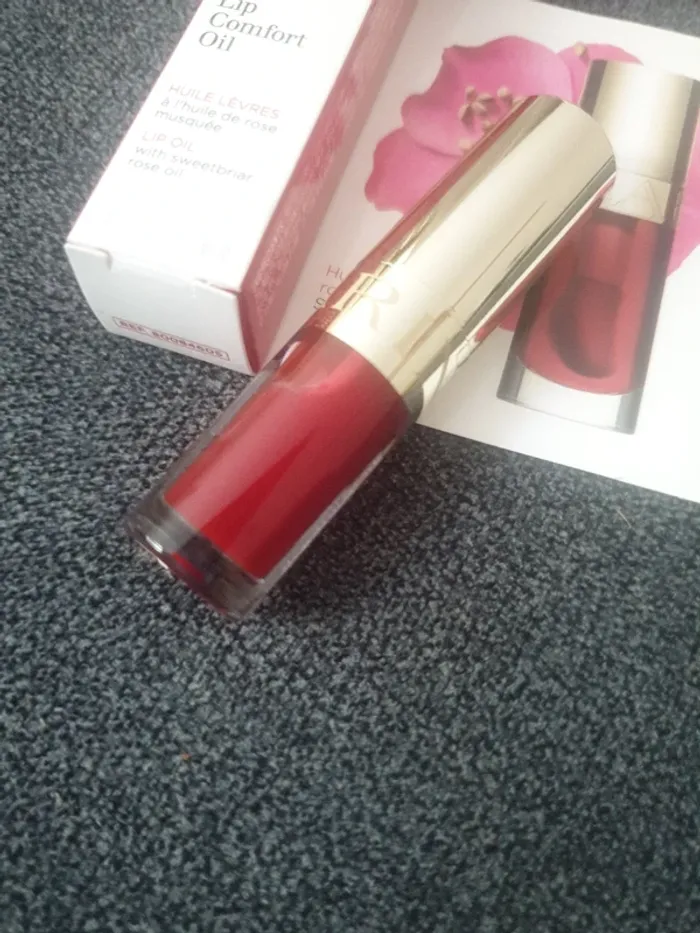 Neuf huile à lèvres rouge marque Clarins - photo numéro 2
