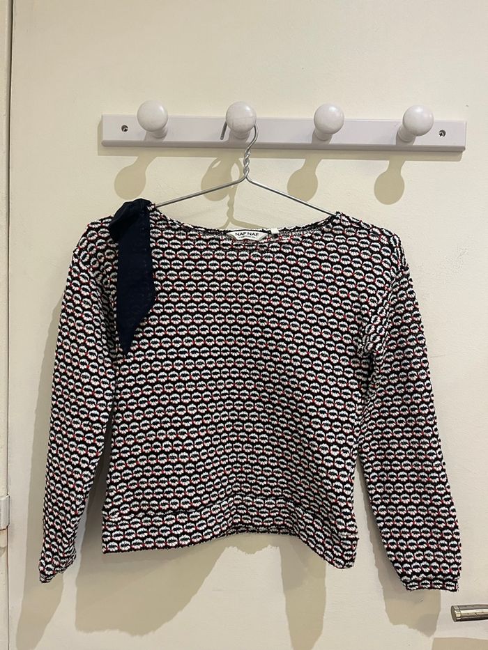 Pull manches longues à motifs  et noeud sur l’épaule noir blanc et rouge naf naf taille XS/34