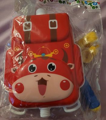 Pistolet à eau rouge avec réserve d'eau sac