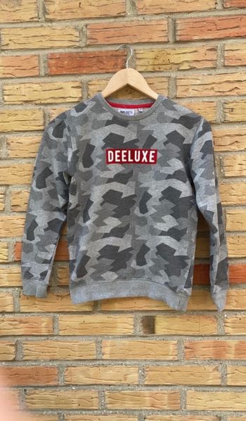 Pull deluxe 12 ans