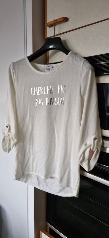 Vend pull blanc écru  taille L.