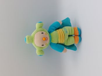 Petite peluche doudou PATOU 2 faces KATHERINE ROUMANOFF cape bleu vert grelot