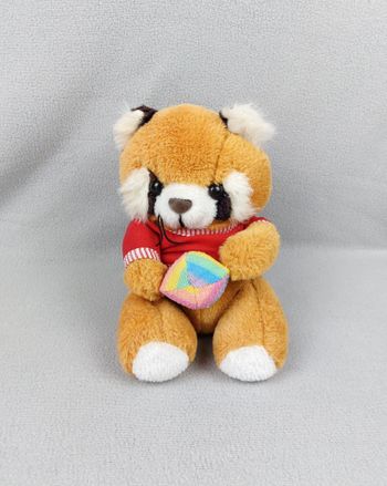 Peluche doudou panda roux orange blanc noir CACI balle grelot tee-shirt rouge