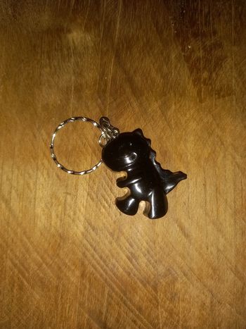 Porte clé dino noir