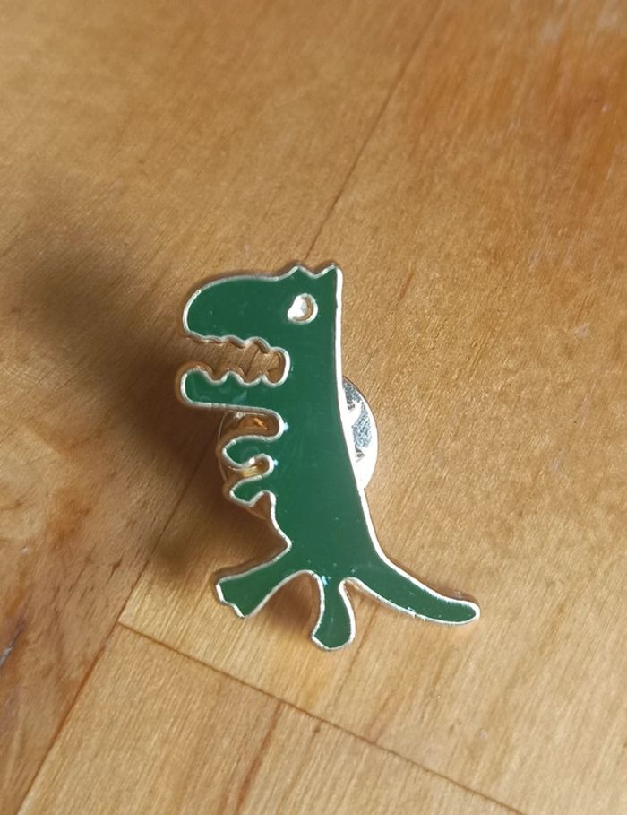 Pin's dinausore vert neuf