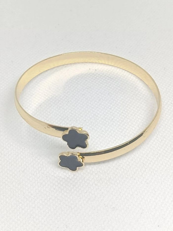 Bracelet rigide ajustable doré trèfle noir
