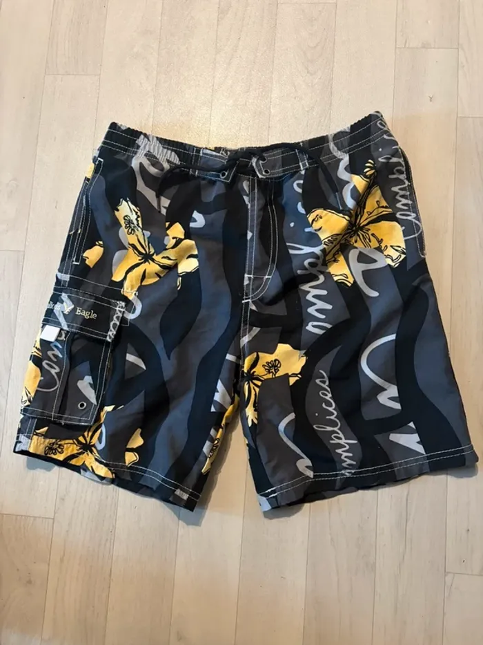 Short de plage complices 14 ans noir et jaune très bon état