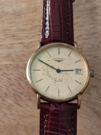 Montre vintage à quartz  longines avec cadran plaqué or