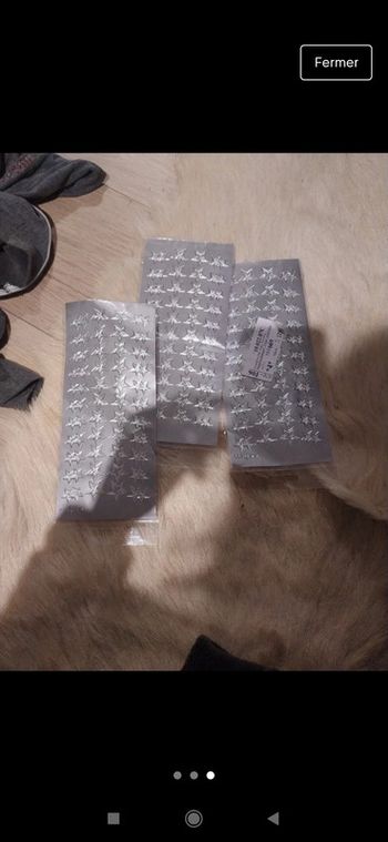 Trois planches de stickers étoile de Noël argenté