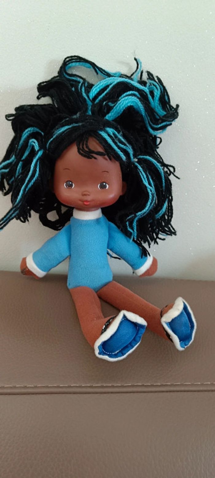 Poupée arc en ciel noire