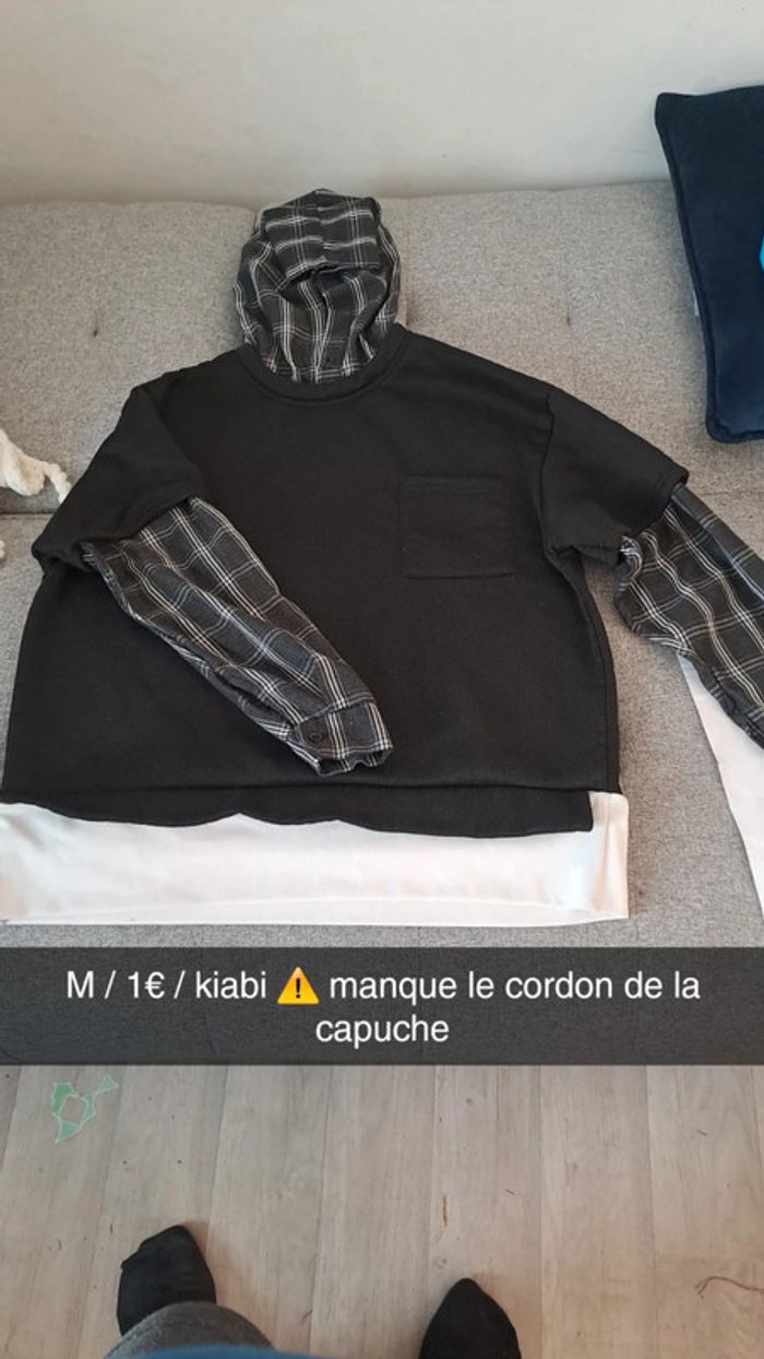 Pull avec manche à carreaux