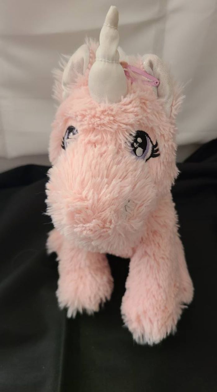 Peluche licorne PRIMARK rose blanc brillant assis
