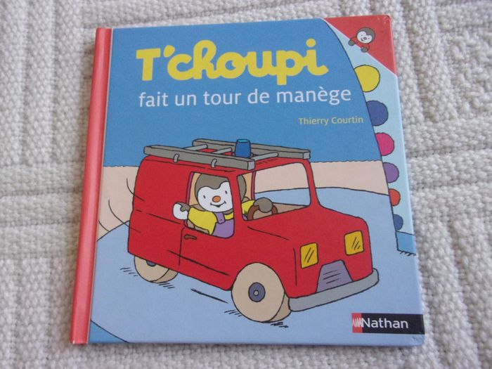 T'choupi fait un tour de manège