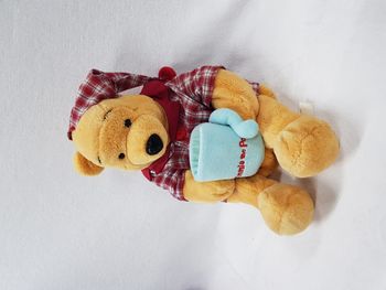 Peluche 53 cm range pyjama winnie l'ourson et son pot de miel Disney