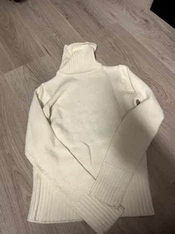 Pull col roulé