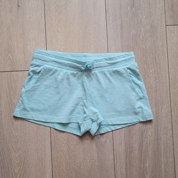 Tres joli short  bleu en coton souple. Fille 12 ans. Marque H&M